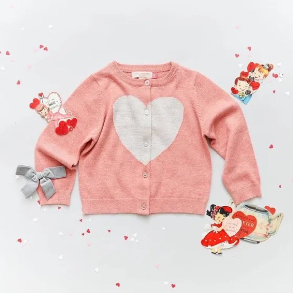 Crewcuts Peach Cardigan with Heart Design An ivory graphic heart motif stands